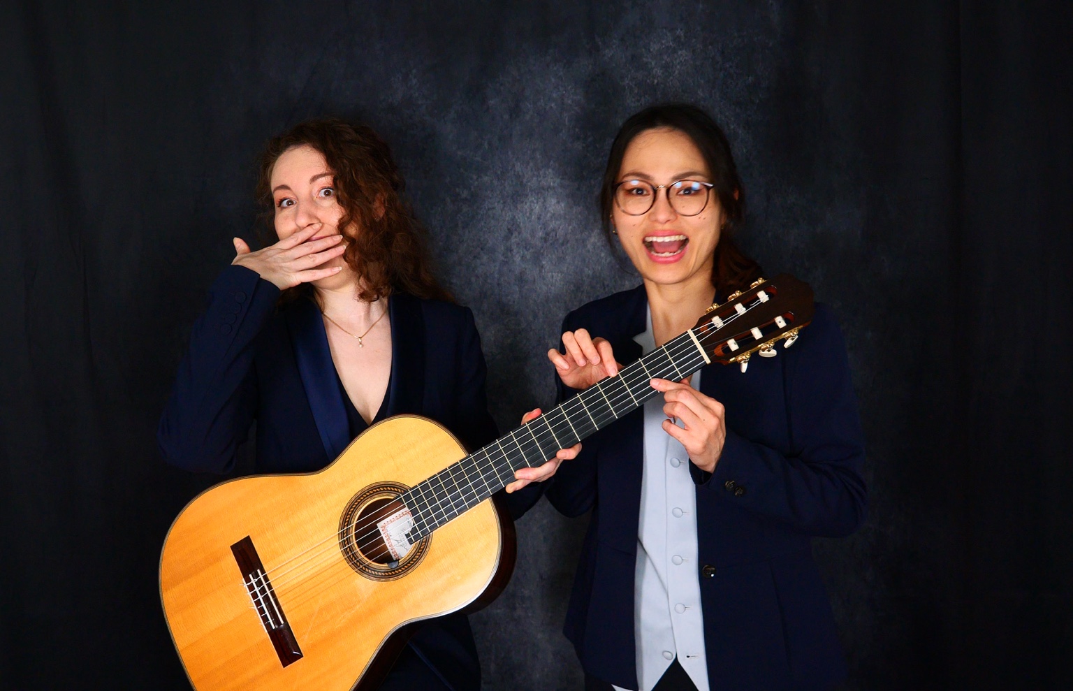 Wizard Duo in a playful portrait with classical guitar